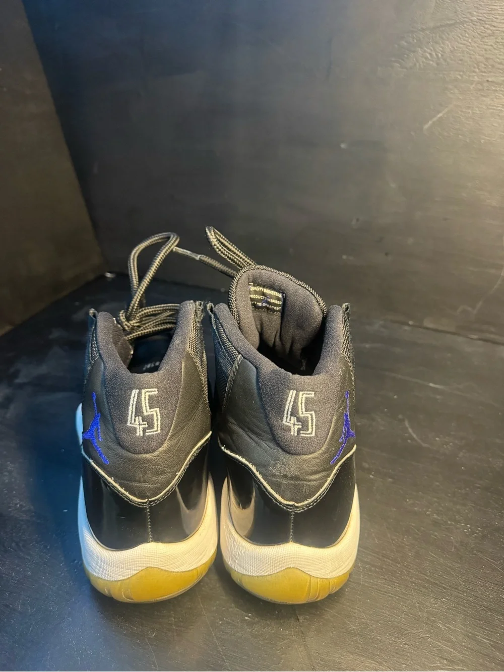 Jordan 11 Men’s Black Sneakers with Blue Jumpman